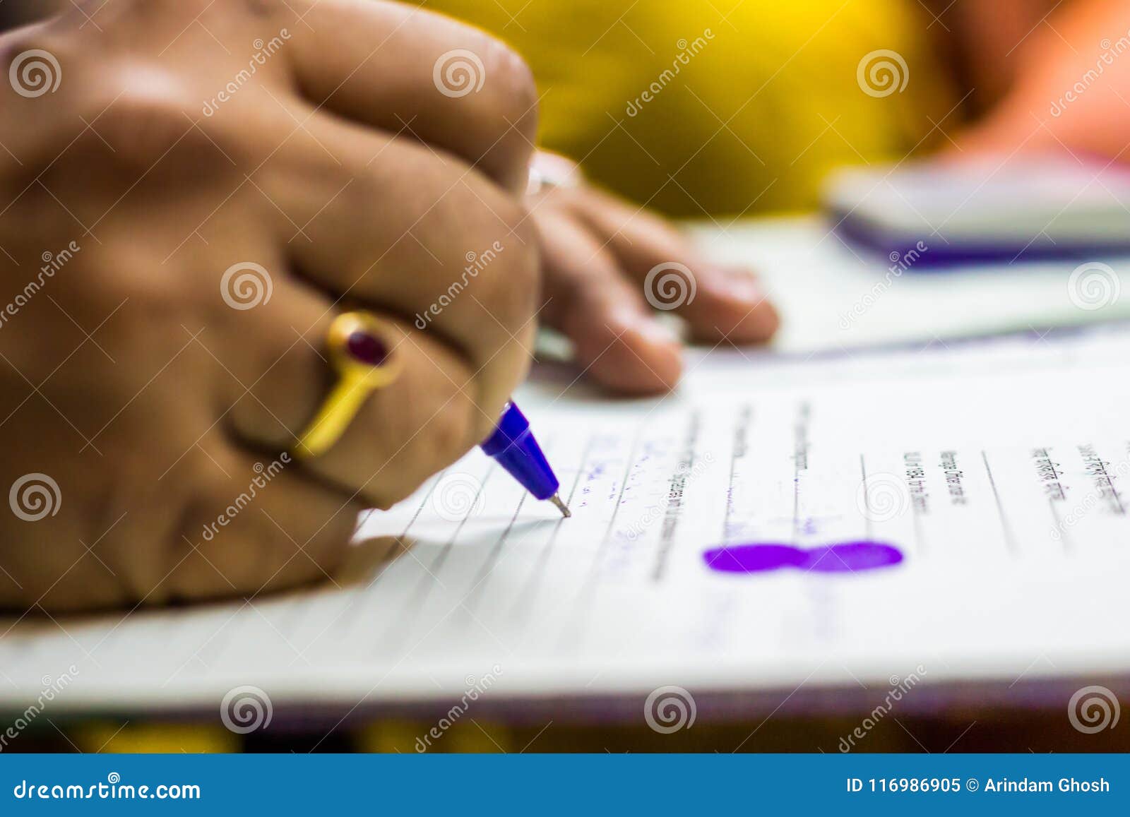 signing on important legal paper with thumb impresion. shallow depth of field