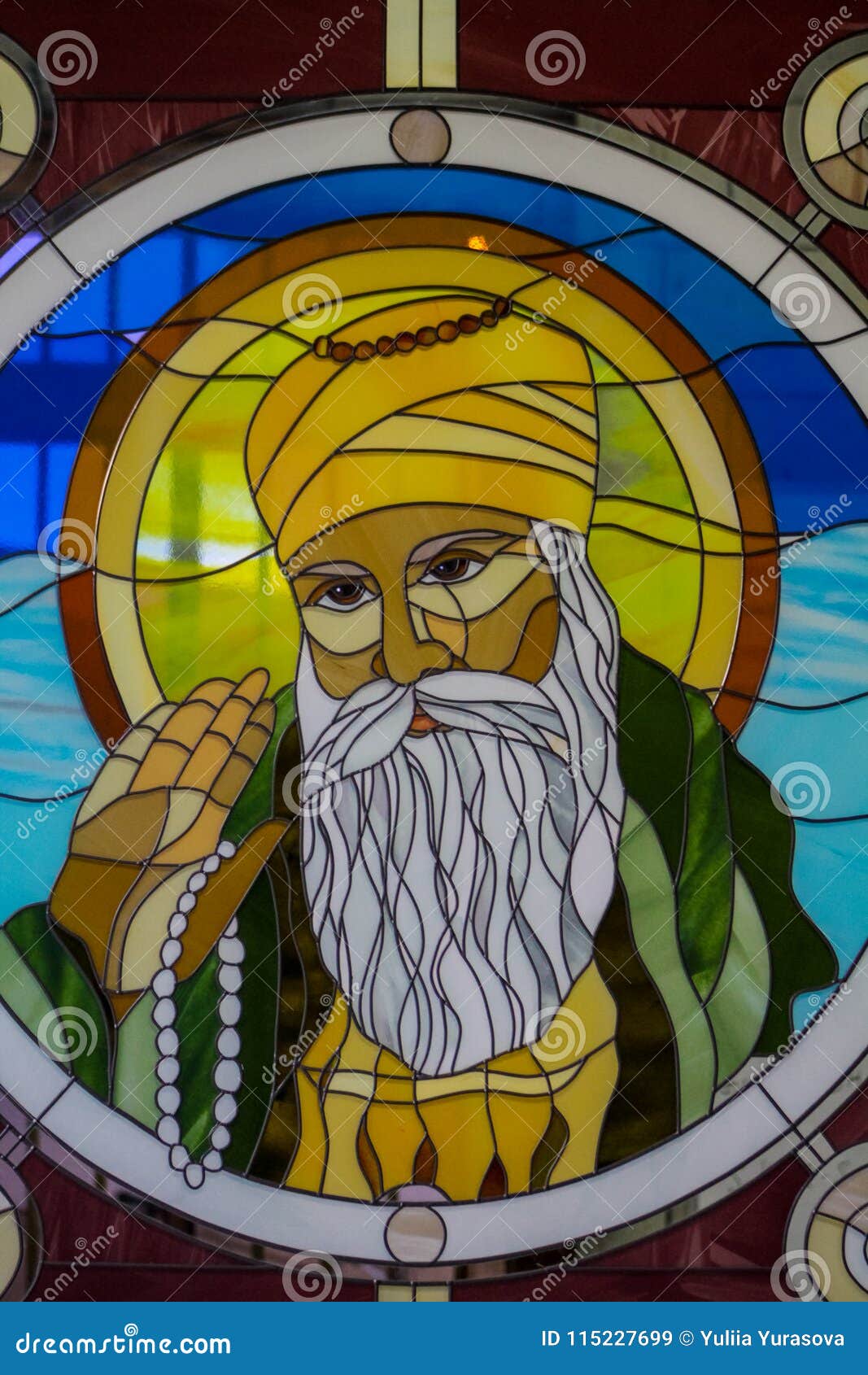 sikh guru portrait on stained glass in the sikh temple