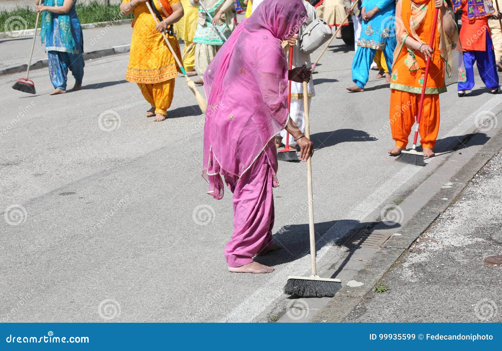 Sikh Religion Women During The Ceremony While Sweeping The Str