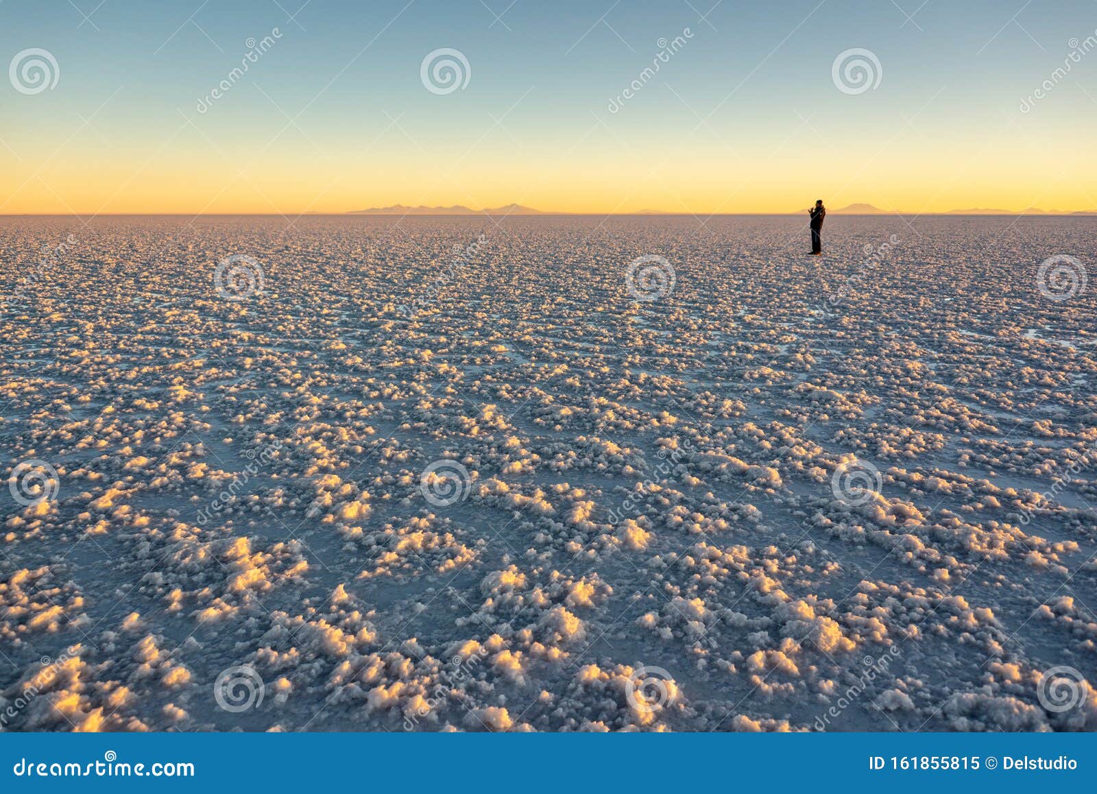 silhouete of a man in salar de uyuni uyuni salt flats at sunset, potosi, bolivia south america