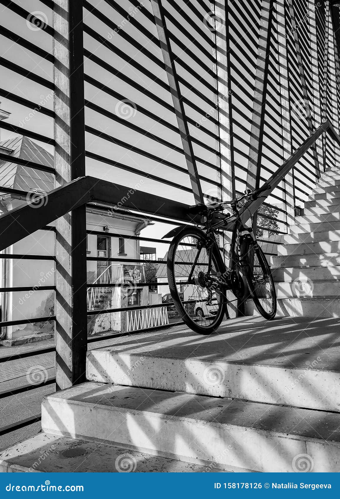 Silhouette of a Bicycle Against Black and White Stripes. Black and ...