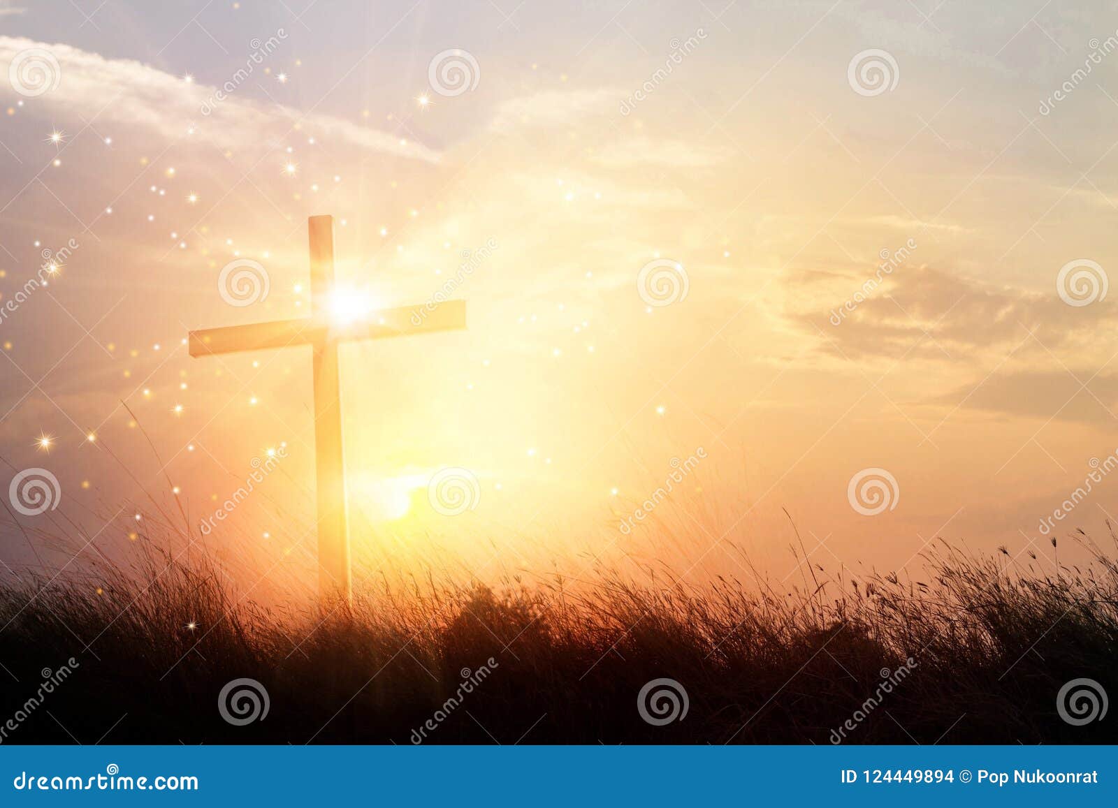 silhouette christian cross on grass in sunrise background m