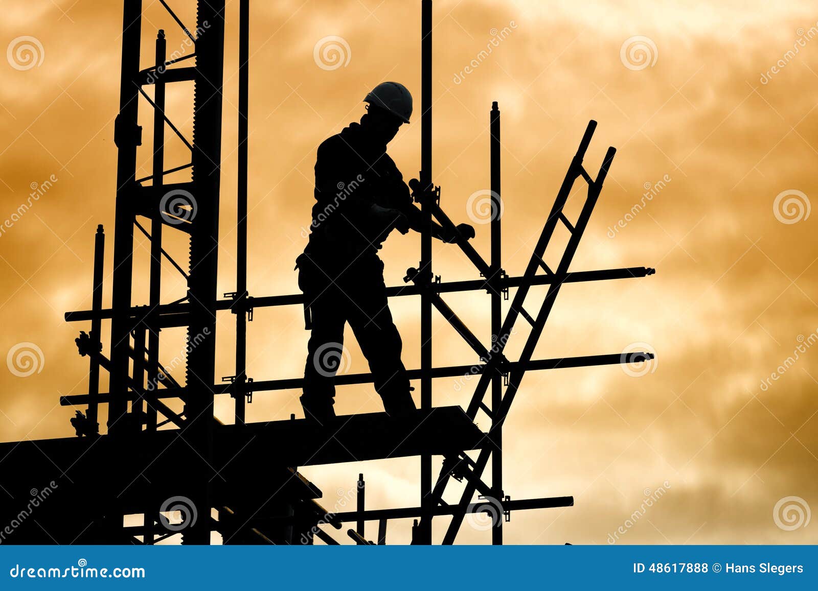 silhouette construction worker on scaffolding building site