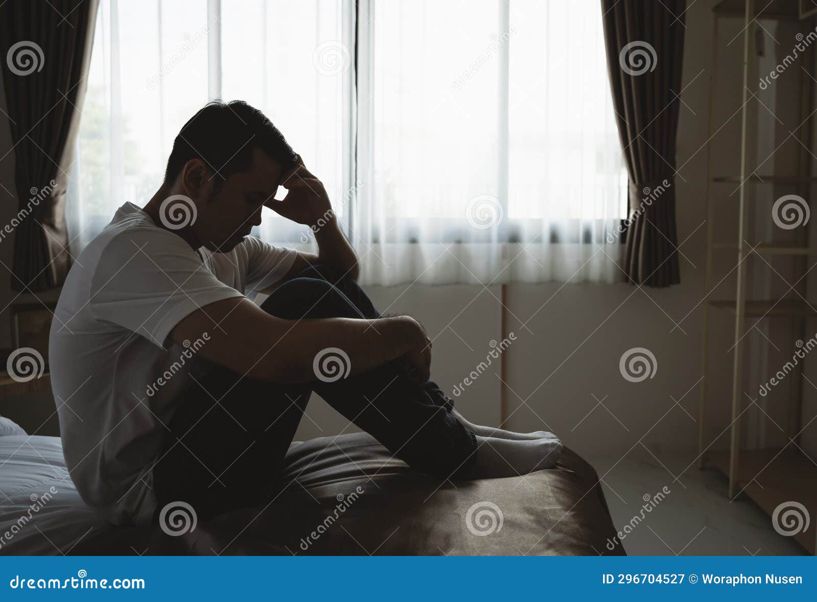 Silhouette Depressed Man Sadly Sitting on the Bed in the Bedroom. Sad ...