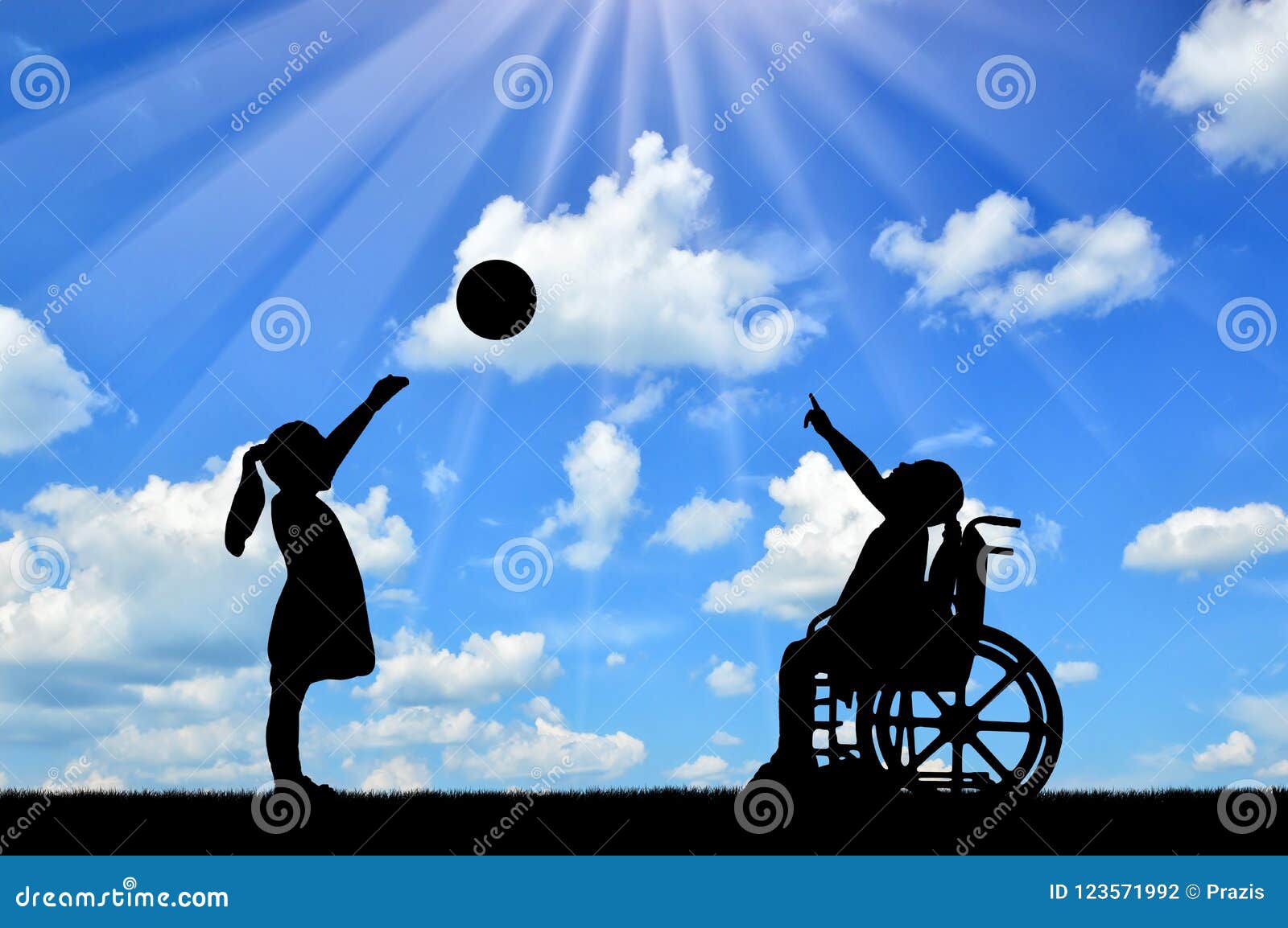 silhouette of a disabled child girl in a wheelchair and healthy girl playing in a ball outdoors