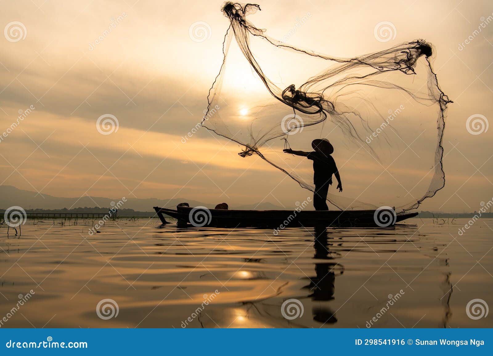 Silhouette Fisherman Throw Net To Catch Fish River Stock Photos