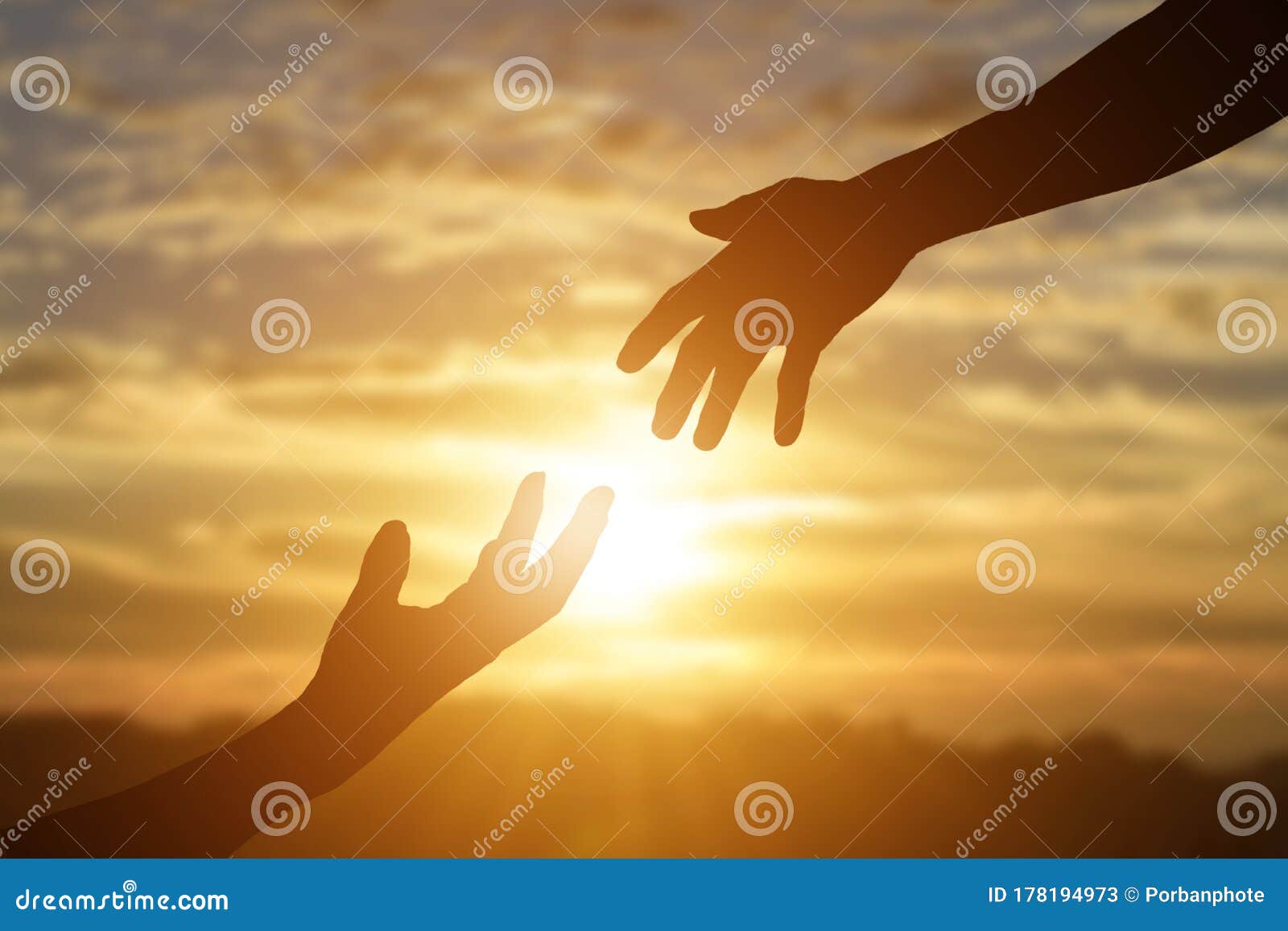 silhouette of giving a helping hand, hope and support each other over sunset