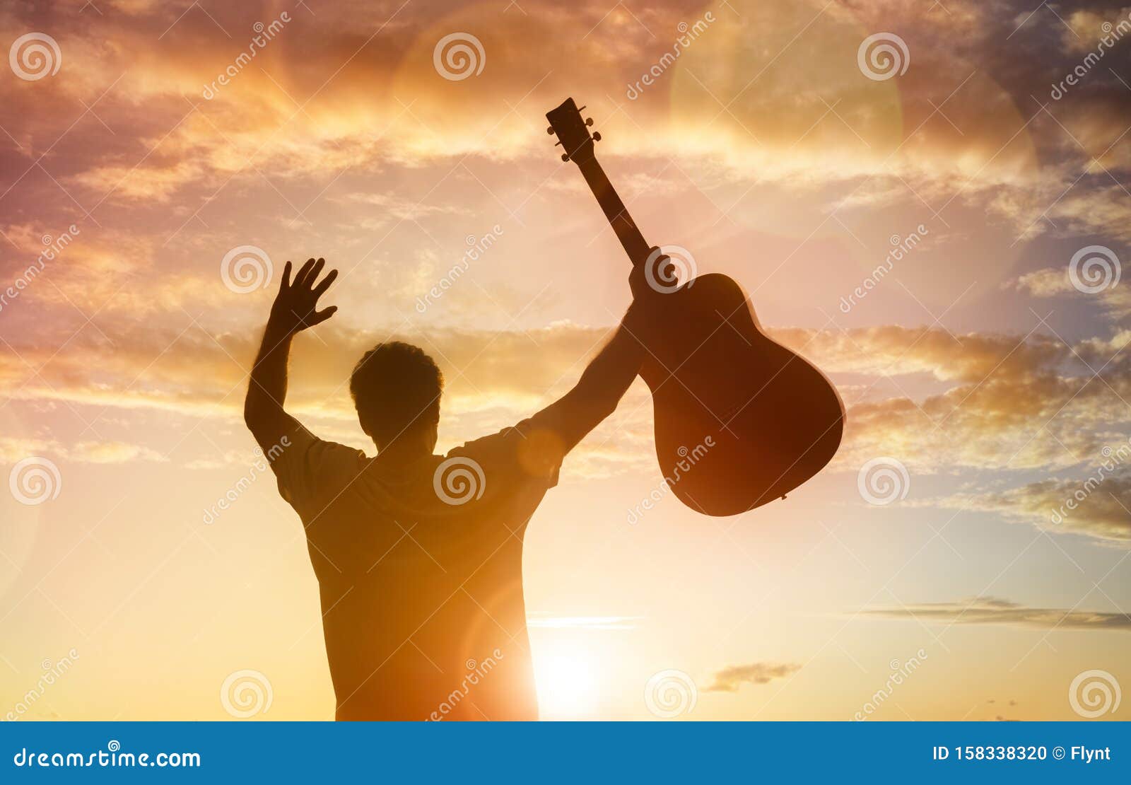 Download Silhouette Of Guitarist Musician Holding Guitar Against ...