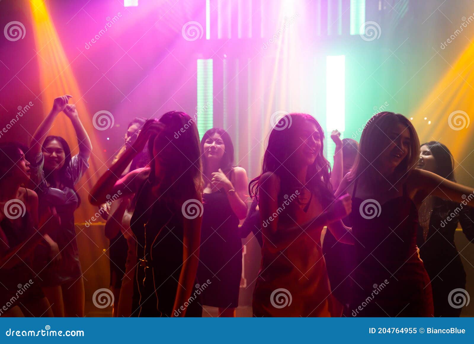 Silhouette Image of People Dance in Disco Night Club To Music from DJ ...