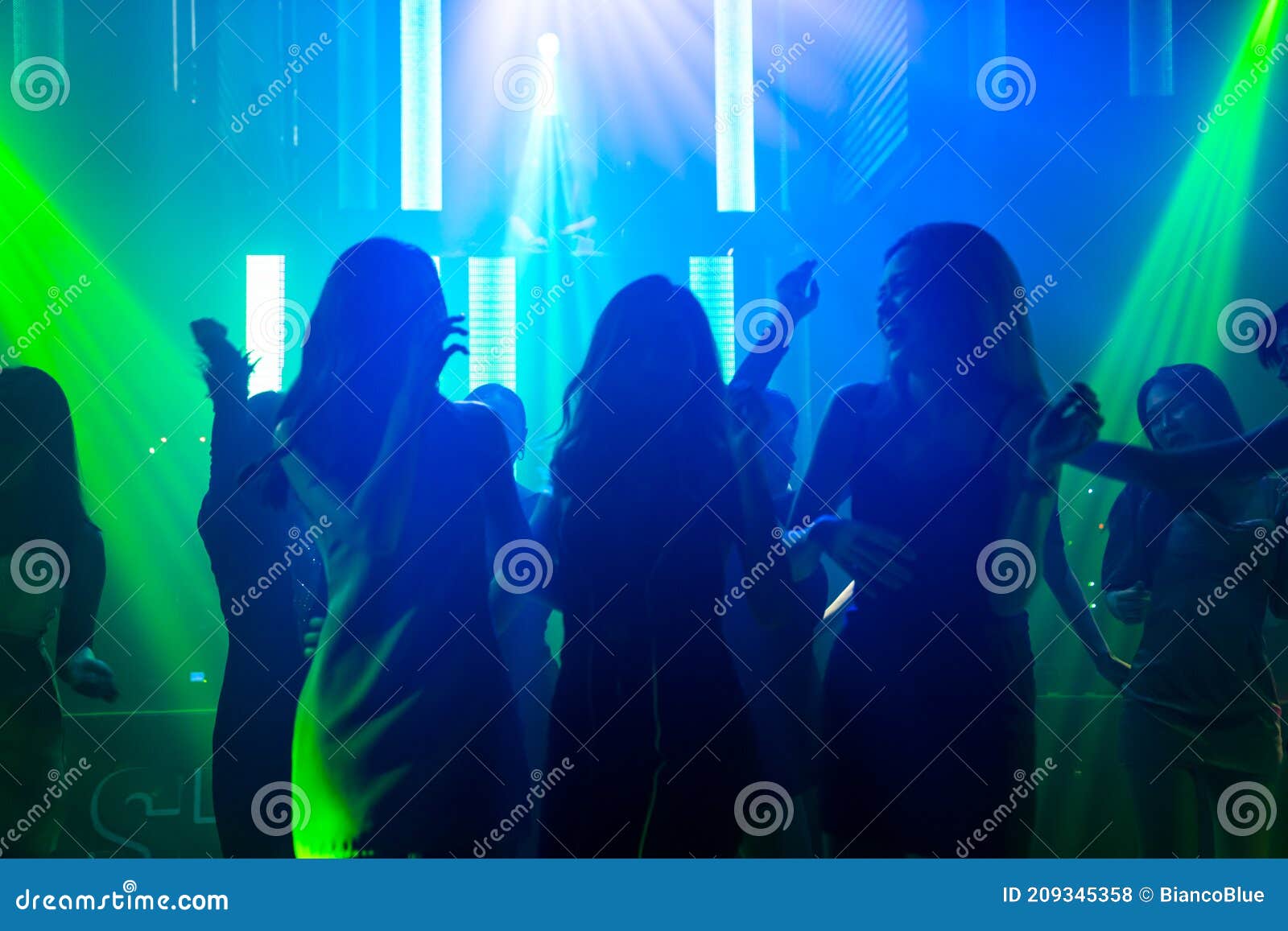 Silhouette Image of People Dance in Disco Night Club To Music from DJ ...
