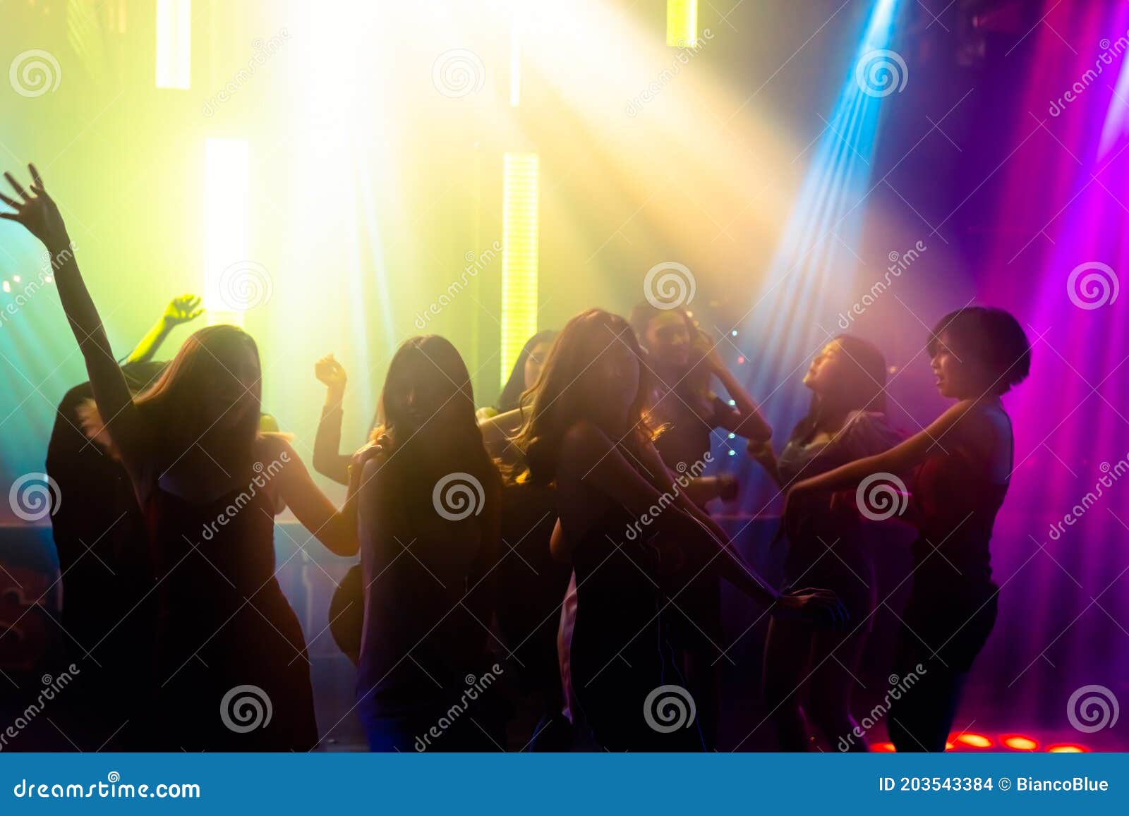 Silhouette Image of People Dance in Disco Night Club To Music from DJ ...