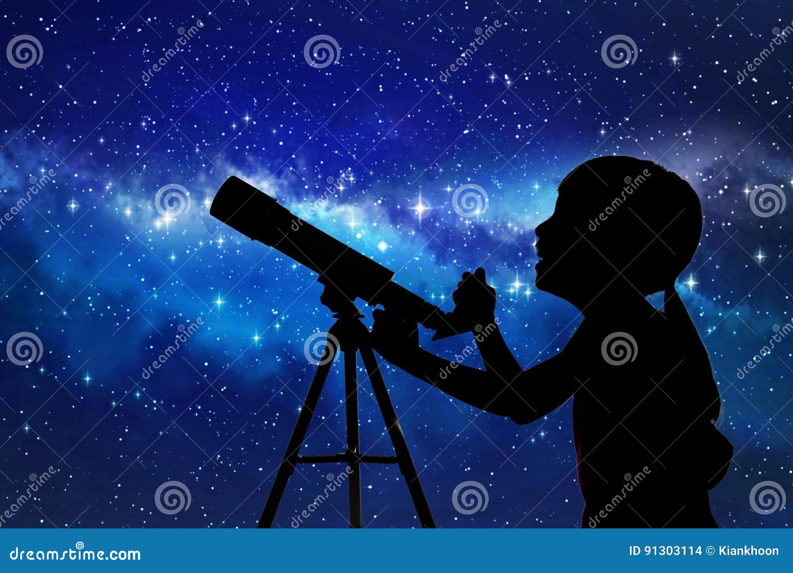 silhouette of little girl looking through a telescope