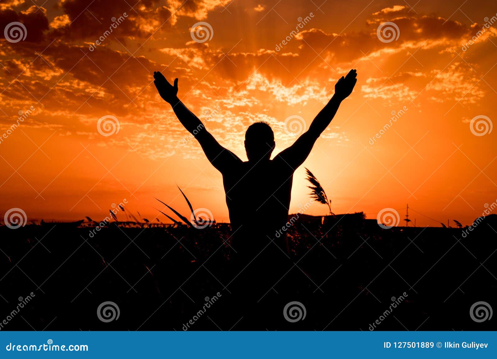 Silhouette of Man with Their Hands in the Sunset. Outdoor Shot Stock ...