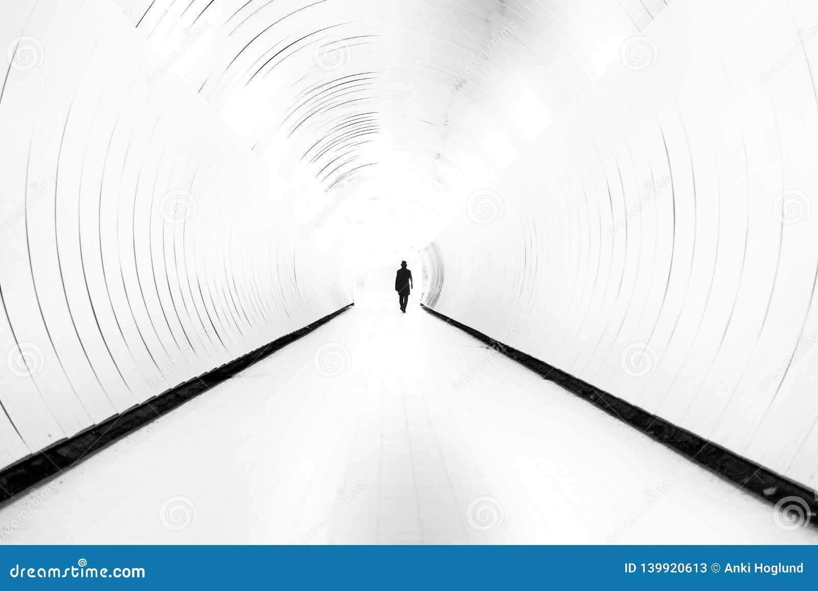 Silhouette Of Man Walking In Bright Tunnel Stock Image - Image of blur ... Silhouette Man Walking Tunnel