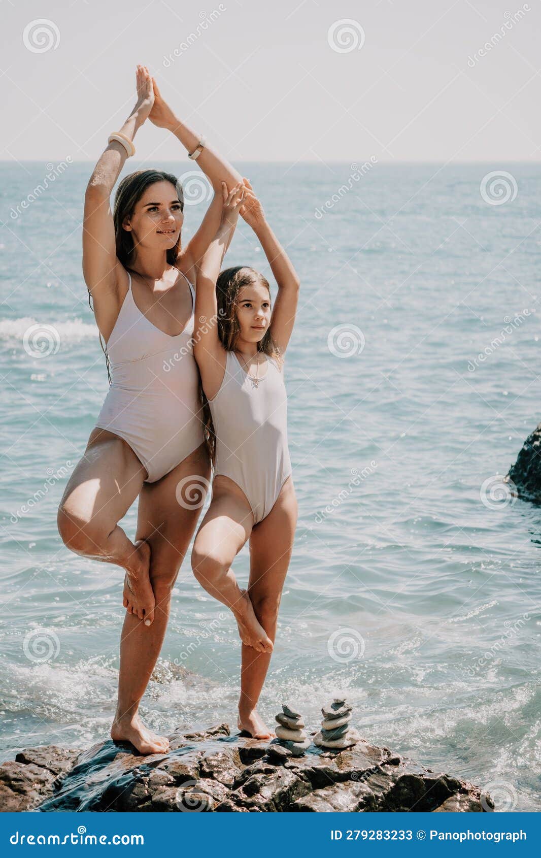 Woman and Her Daughter Practicing Balancing Yoga Pose on One Leg Up  Together on Rock in the Sea. Silhouette Mother and Stock Image - Image of  healthy, girl: 279283233