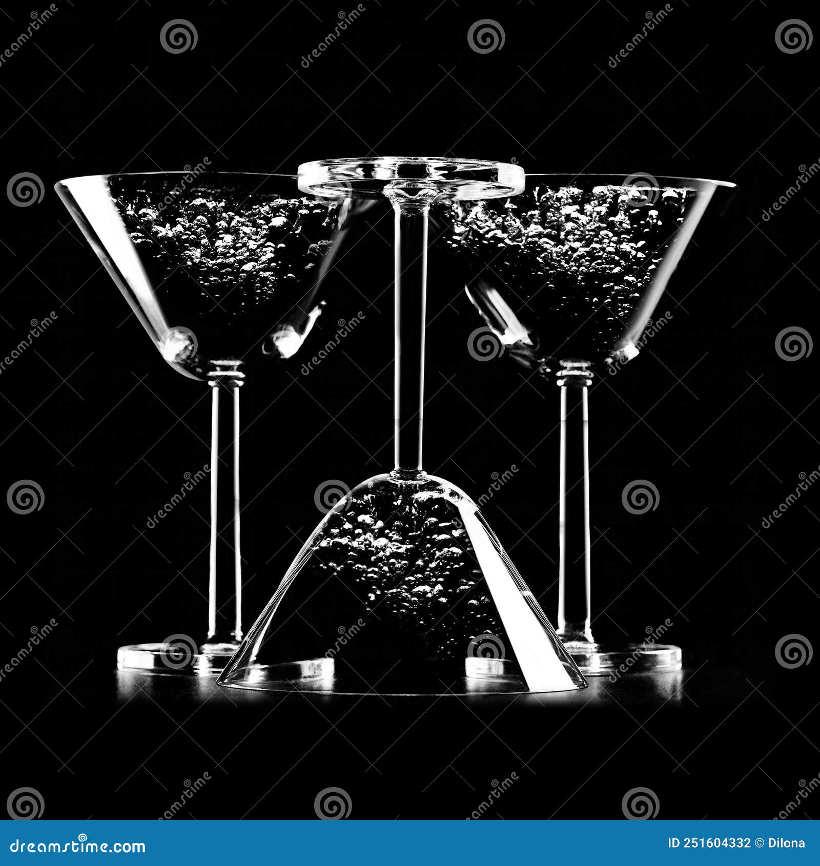 Silhouette of Cocktail Glasses Isolated on Black Background with Watter