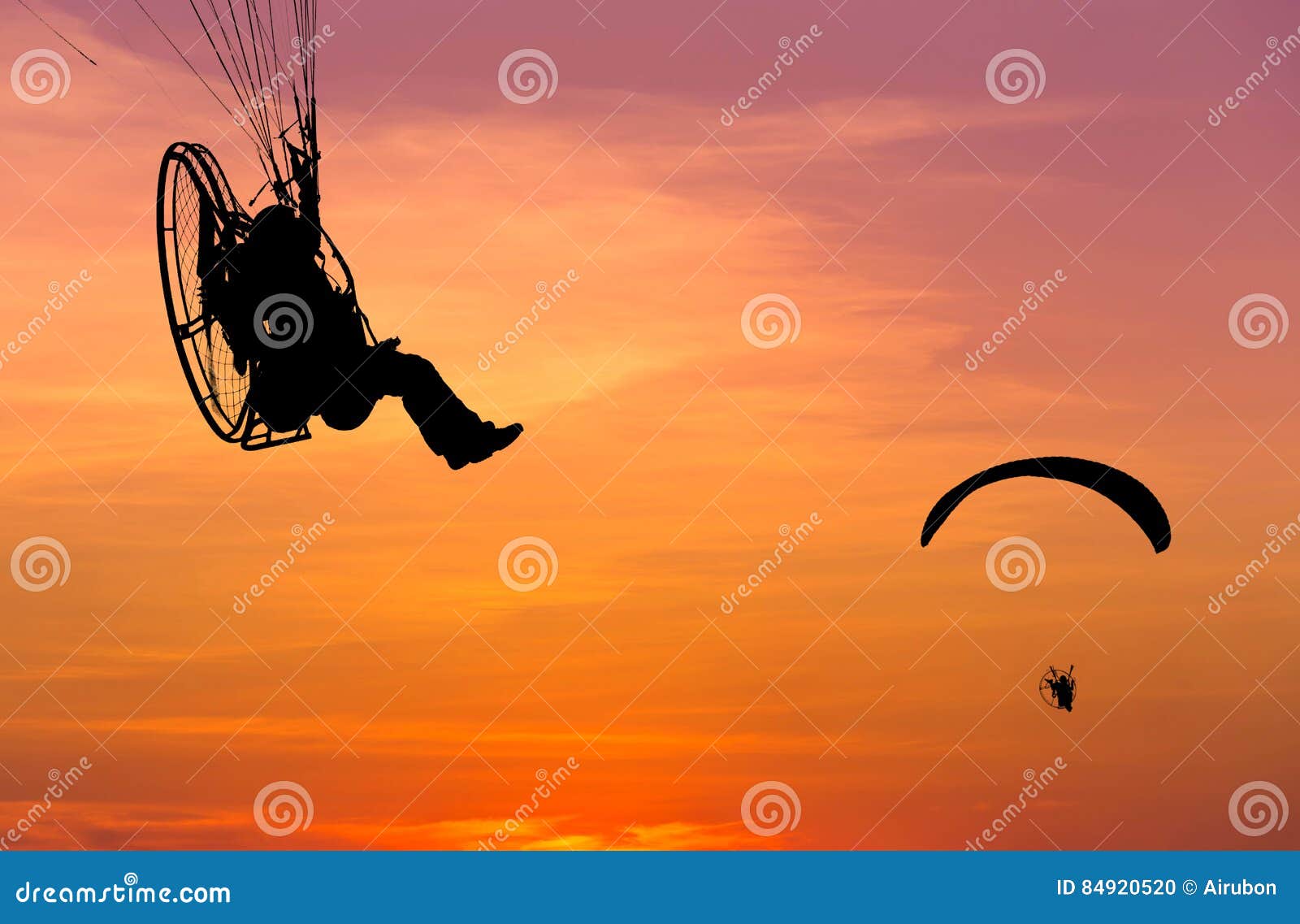Silhouette Of Paramotors Flying To Sky On Sunset Adventure Man Active