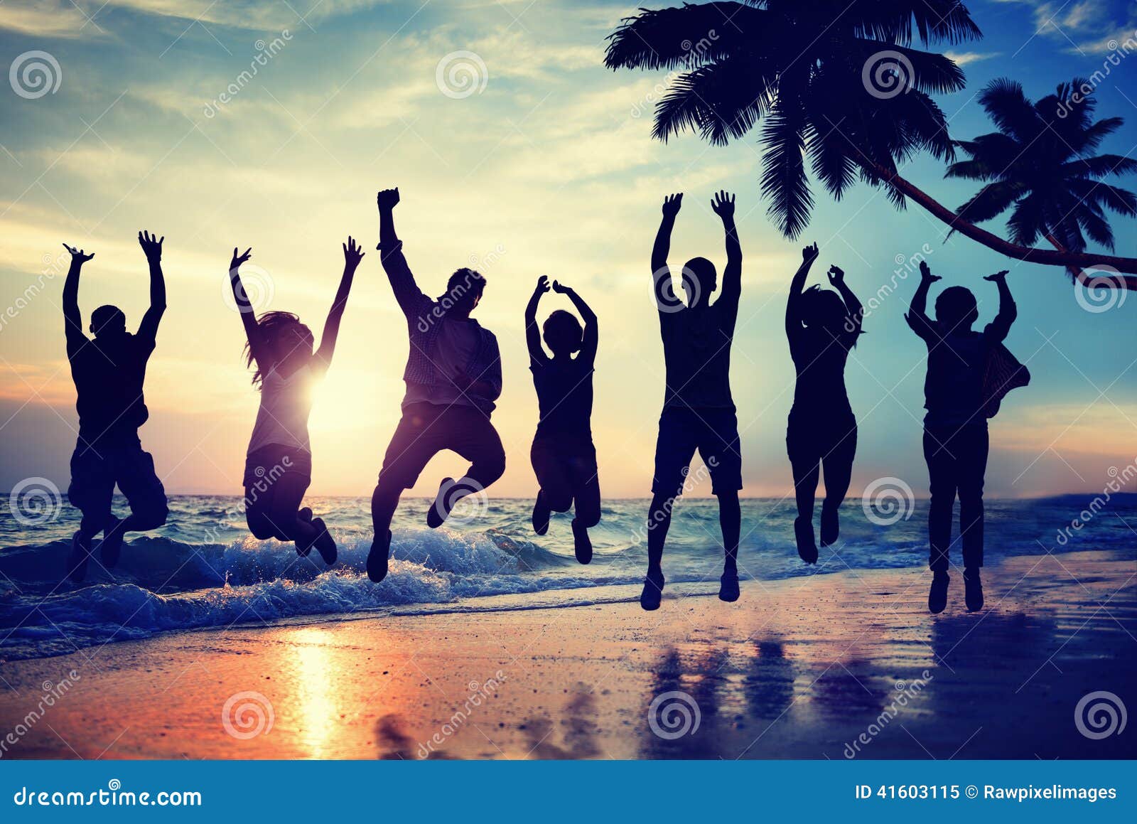 silhouette people jumping with excitement on a beach