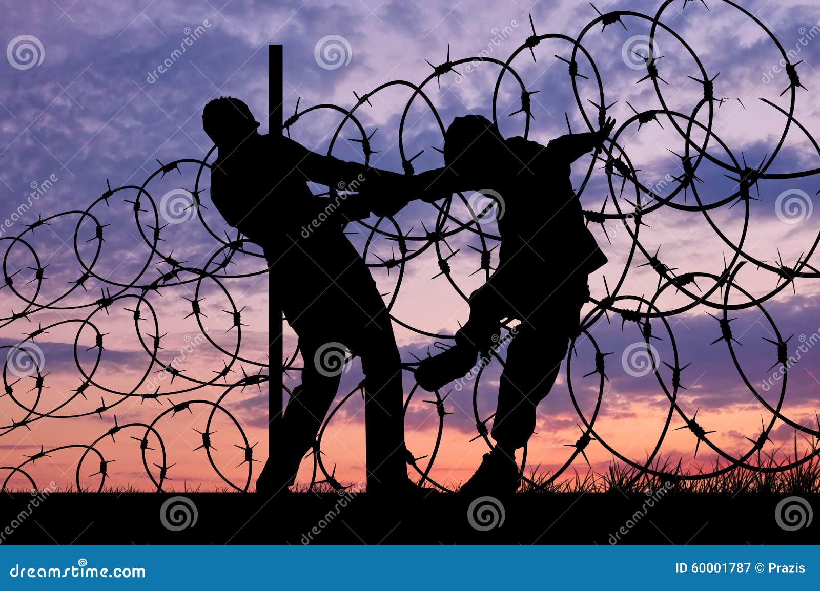 silhouette of refugees and barbed wire