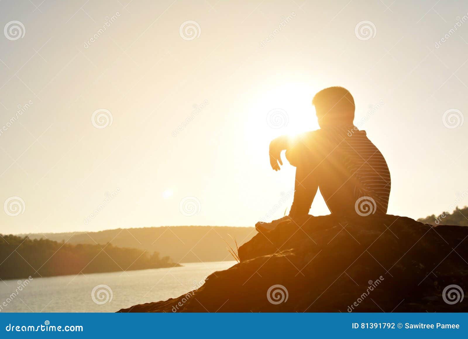 Silhouette of Sad Boy and Sitting on the Rock in River Stock Photo ...