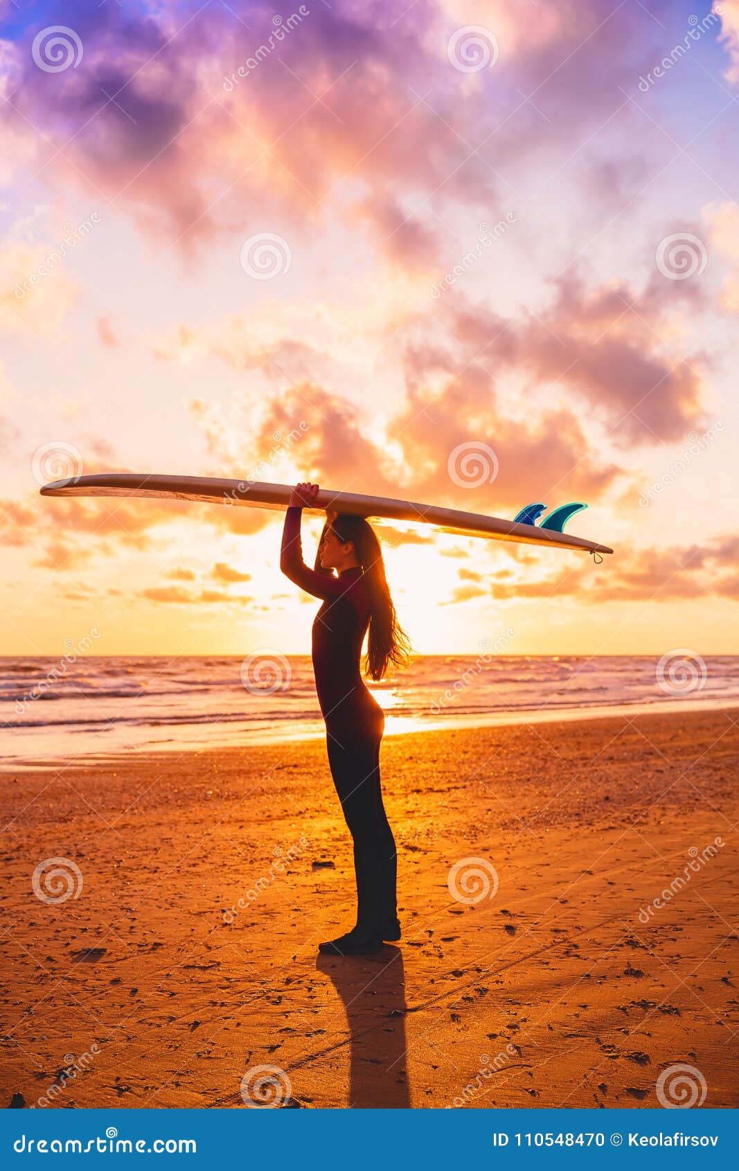 Silhouette with Surfer Girl Holding Surfboard on a Beach at Warm Sunset ...