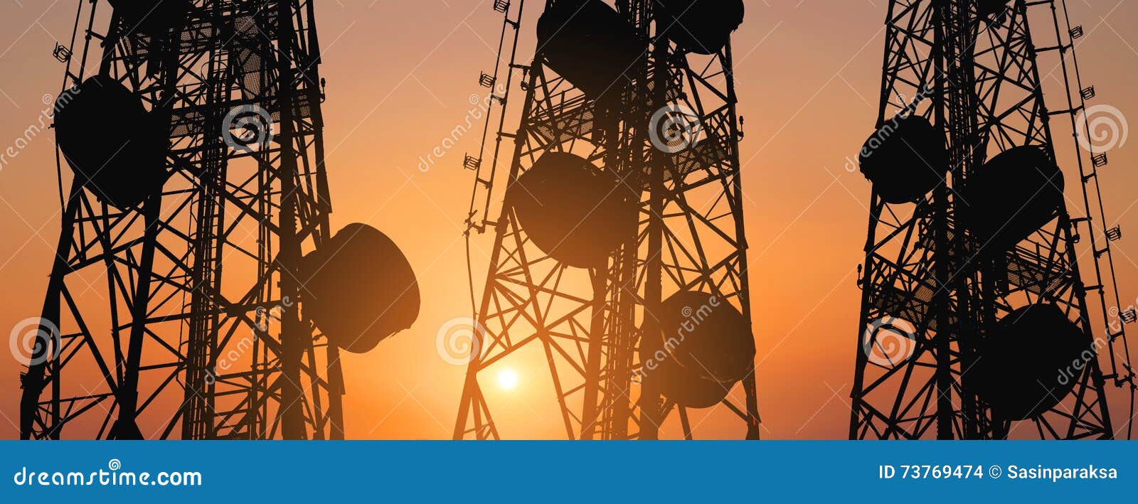 silhouette, telecommunication towers with tv antennas and satellite dish in sunset, panorama composition