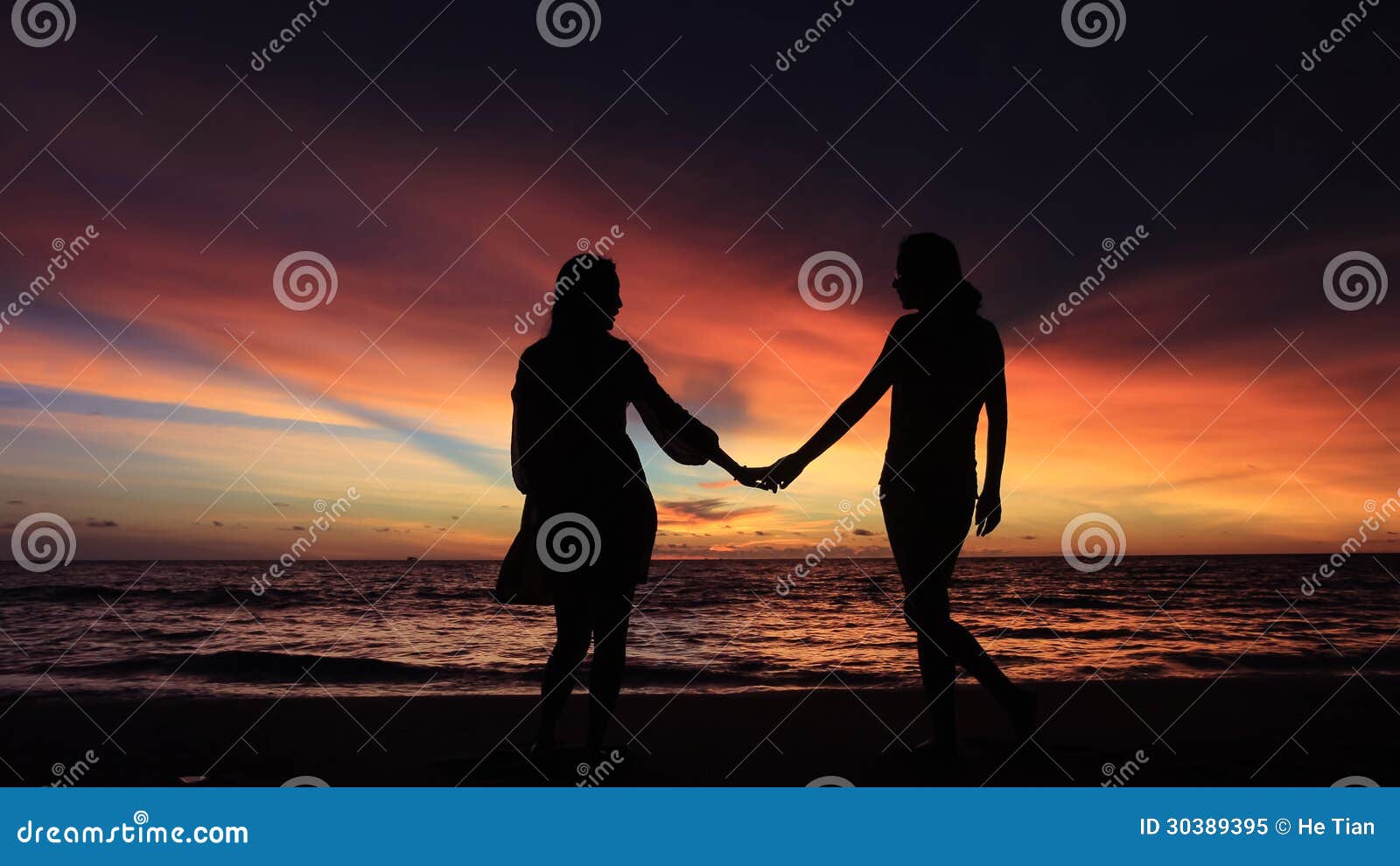 Silhouette Of Two Girls Holding Hands Together On Beach Stock Photo Megapixl Silhouette Of Two Girls Holding Hands Together On Beach Stock Photo Megapixl