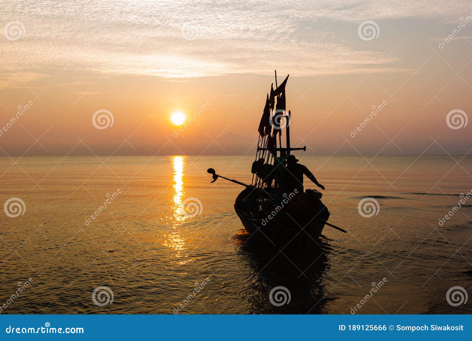Silhouette of Two People on a Fishing Boat. Stock Photo - Image of