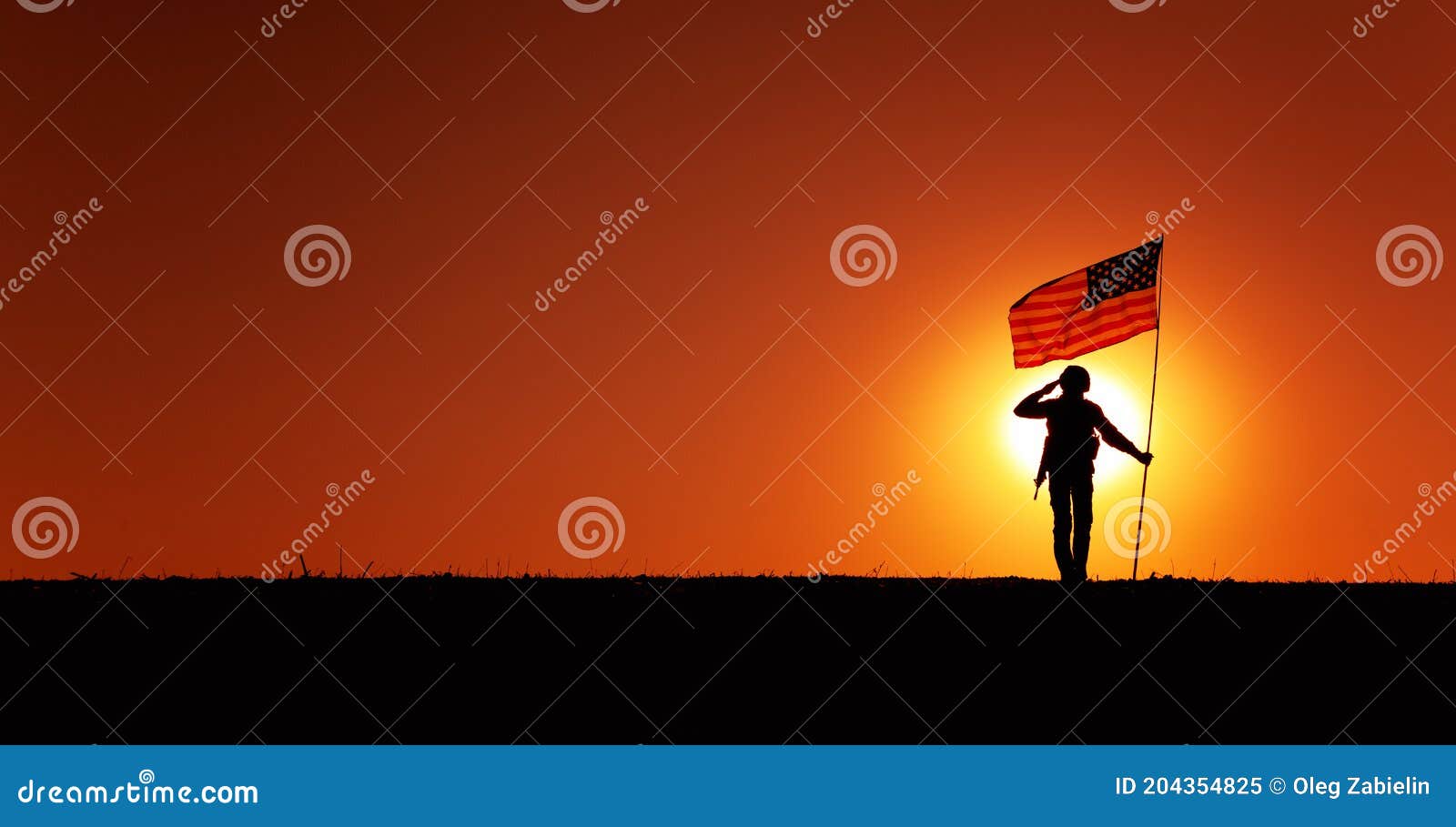 usa soldier with flag saluting on sunset horizon