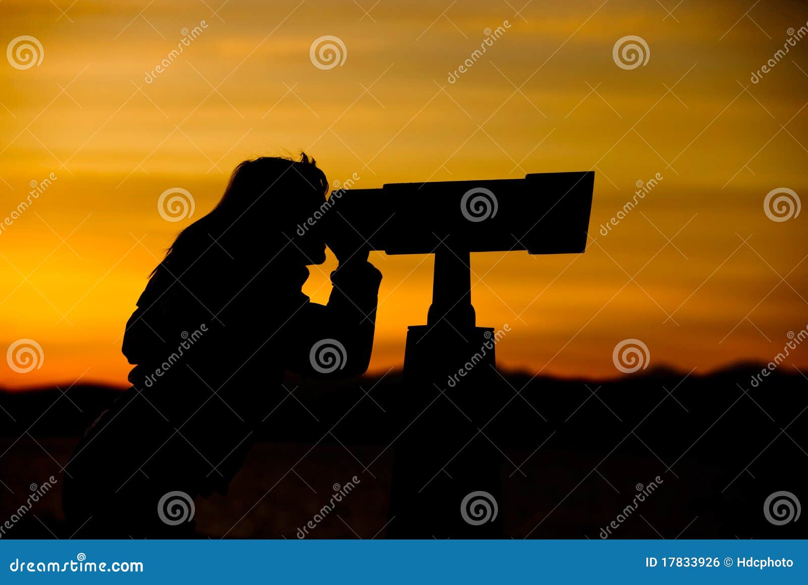 silhouette of woman looking through telescope