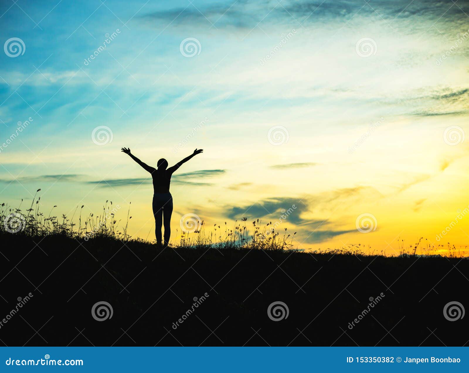 silhouette of woman praying over beautiful sky background