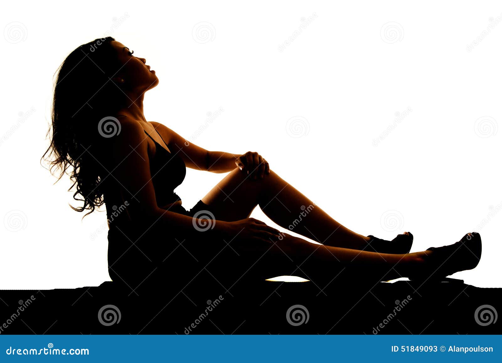Young Girl With Brown Hair Resting Head On Knee High-Res 