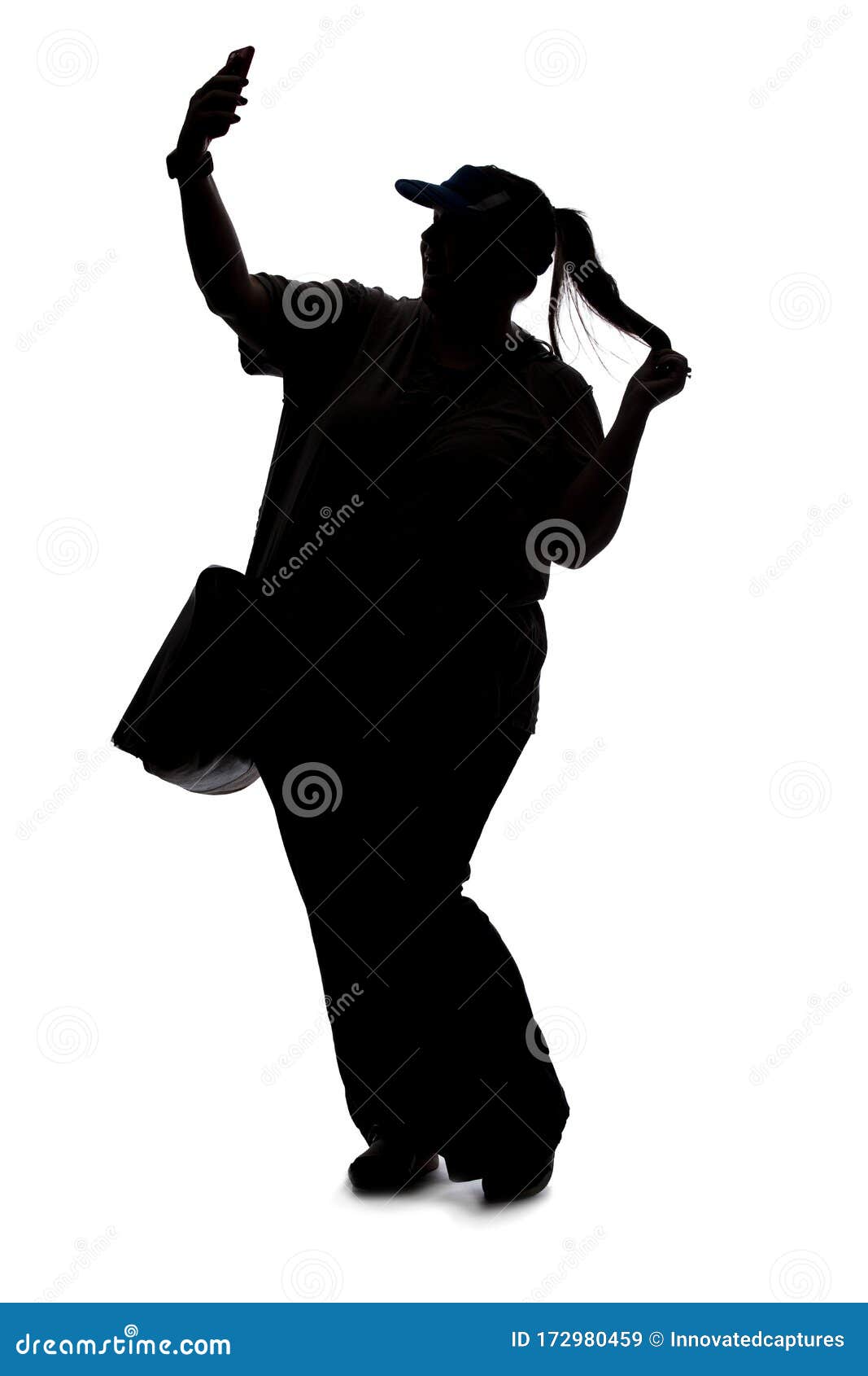 Silhouette of a Woman Taking Selfie or Streaming in Social Media Stock Image of curvy, media: 172980459
