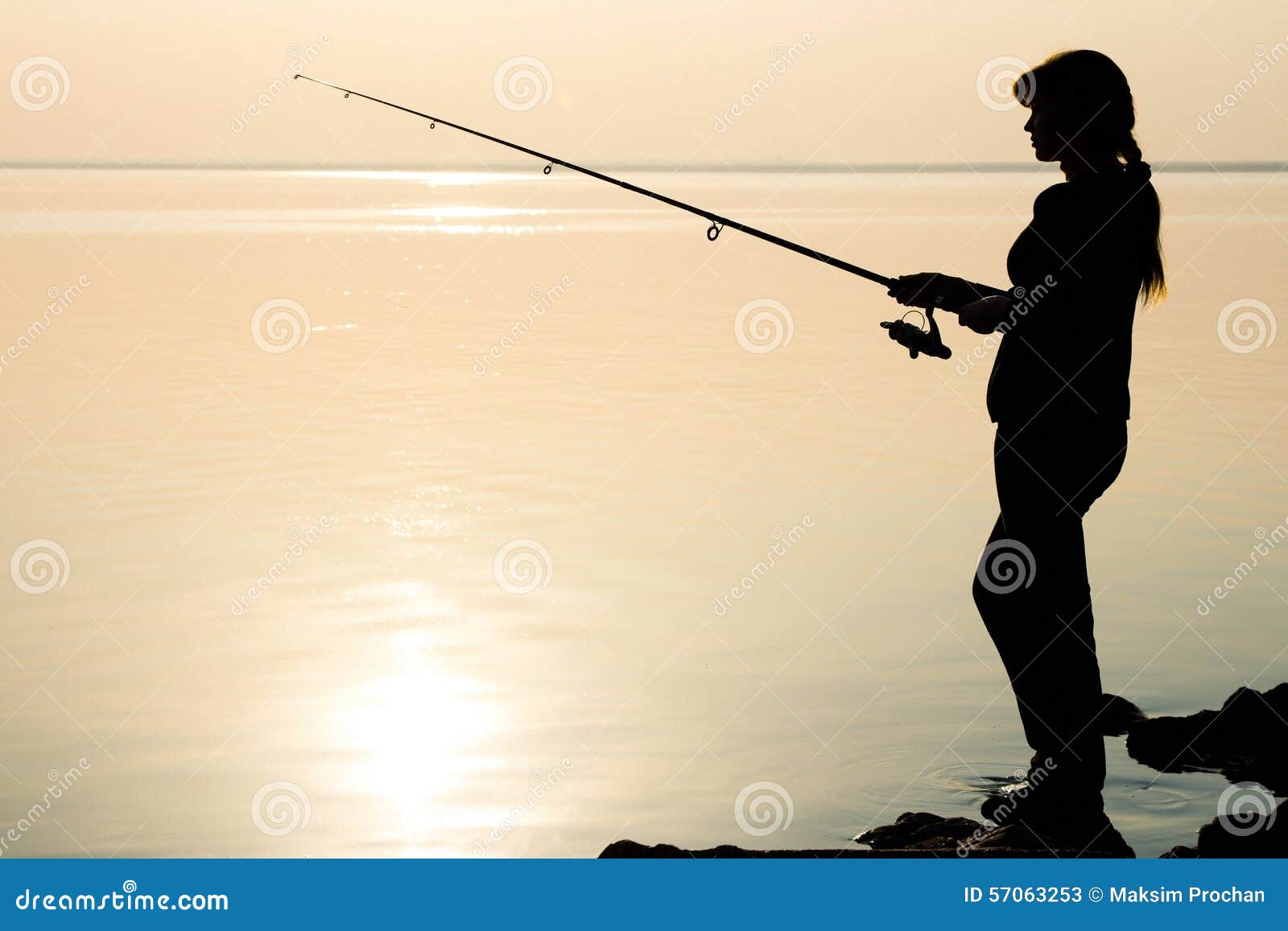 Download Silhouette Of A Young Girl Fishing At Sunset Stock Photo ...