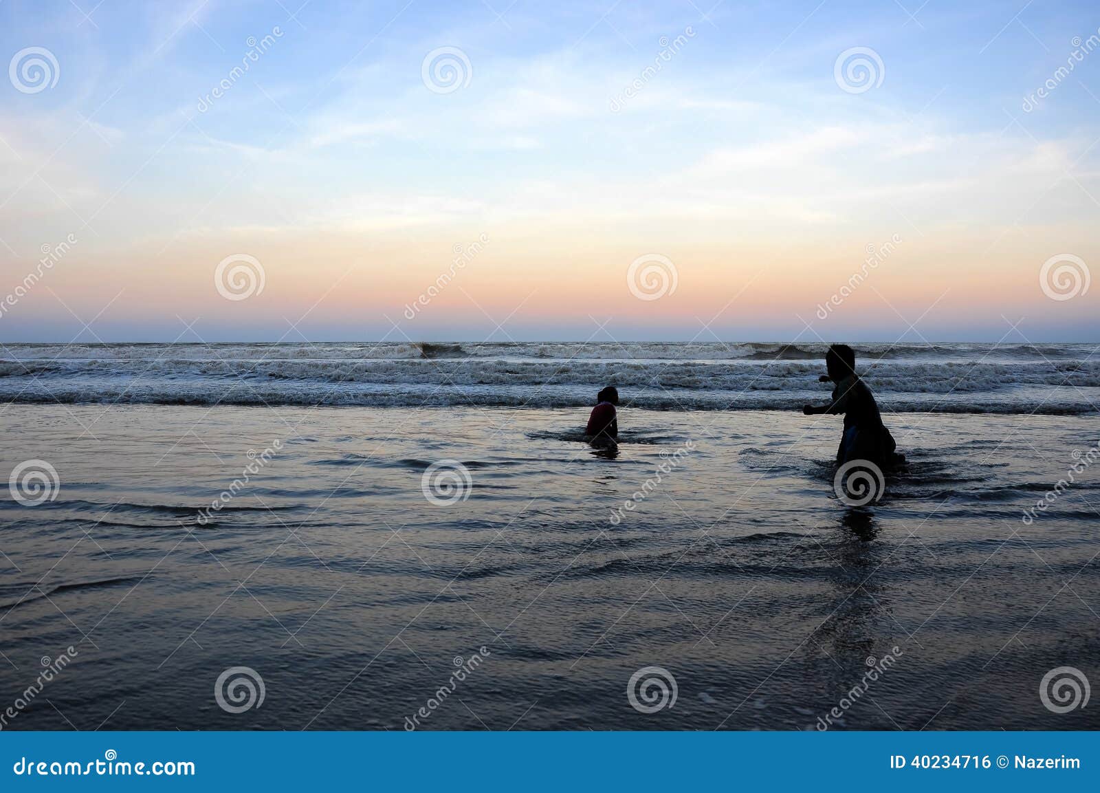 Silhouette of Young Kids Playing at the Beach during Sunset Stock Photo ...