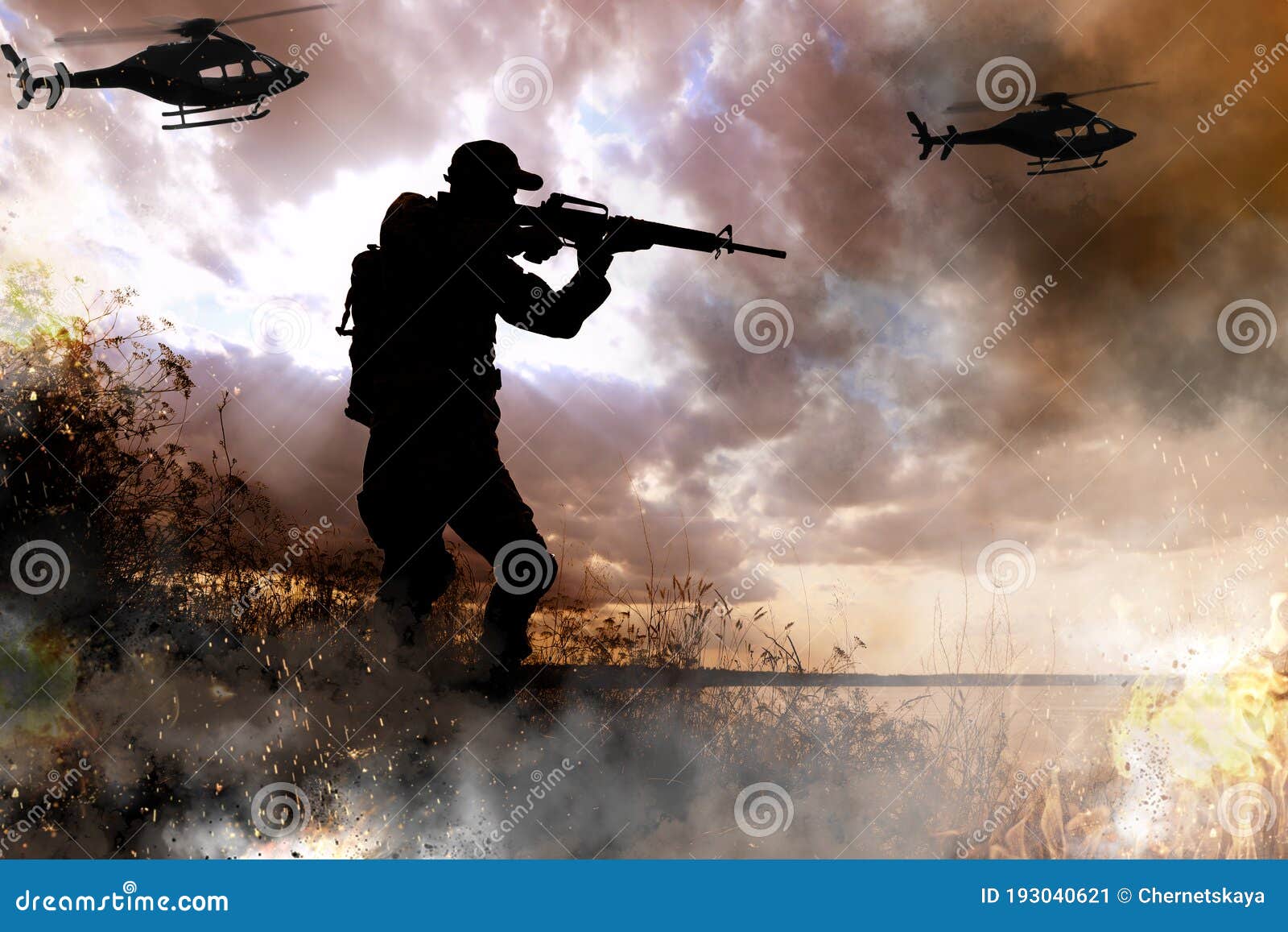 silhouettes of soldier and helicopters in combat zone. military