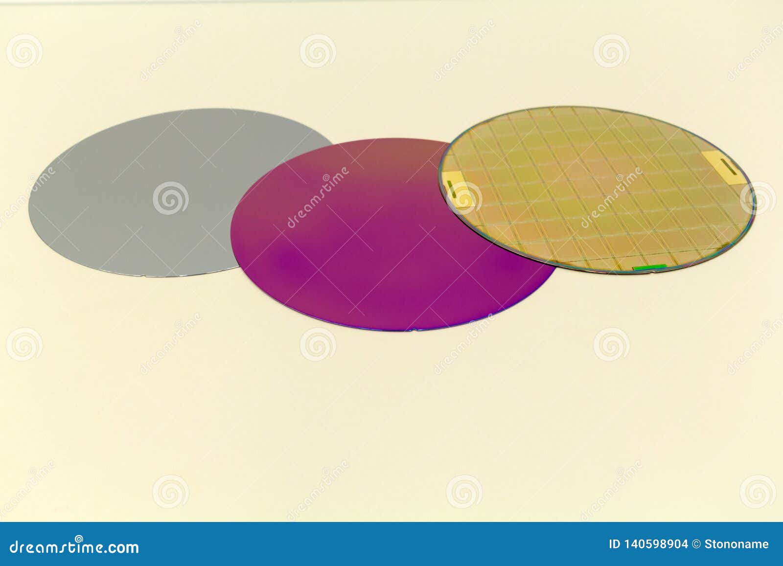 silicon wafers three types -empty grey wafer,purple wafer with sio film and gold wafes with microchips