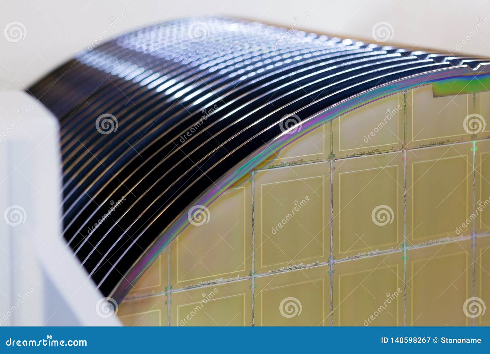 silicon wafers in white plastic holder box on a table- a wafer is a thin slice of semiconductor material, such as a crystalline