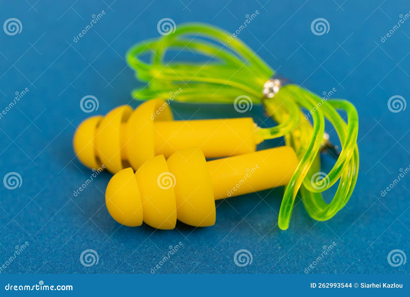Silicone Ear Plugs for Human Ears on Blue Background Stock Photo