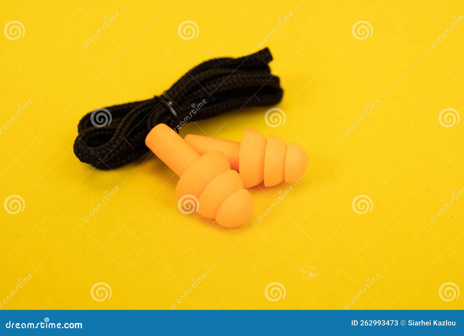 Silicone Ear Plugs for Human Ears on Yellow Background Stock Image