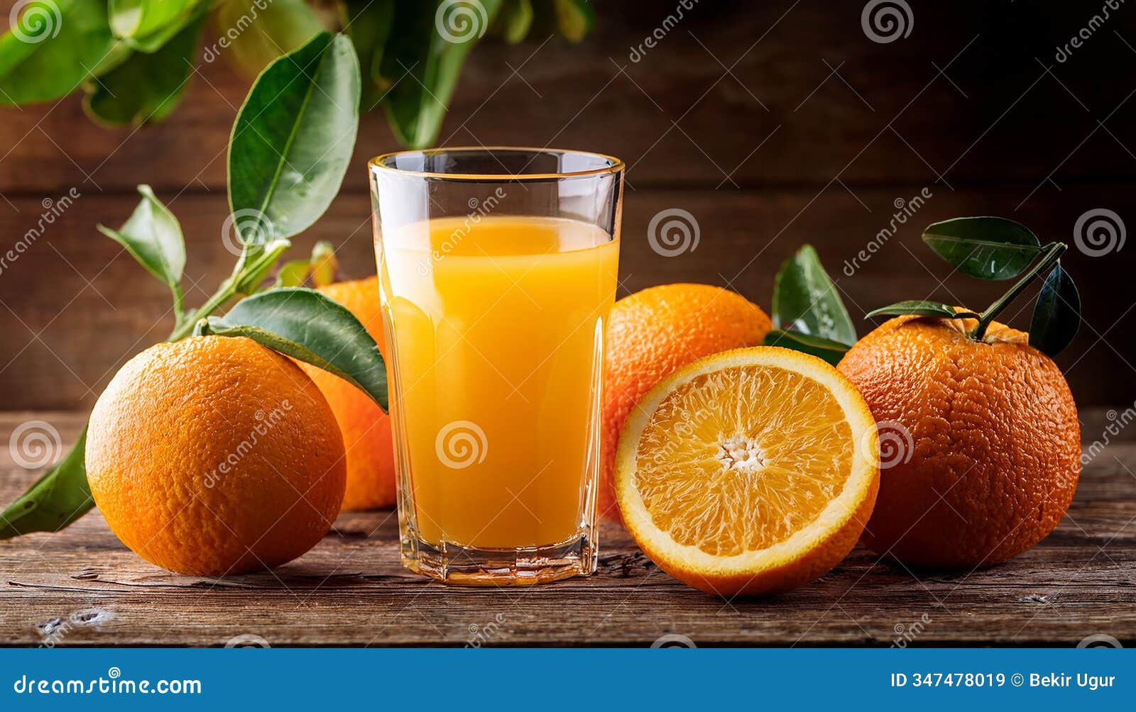 sill life composition with glass of fresh orange juice with oranges on a vintage wooden background