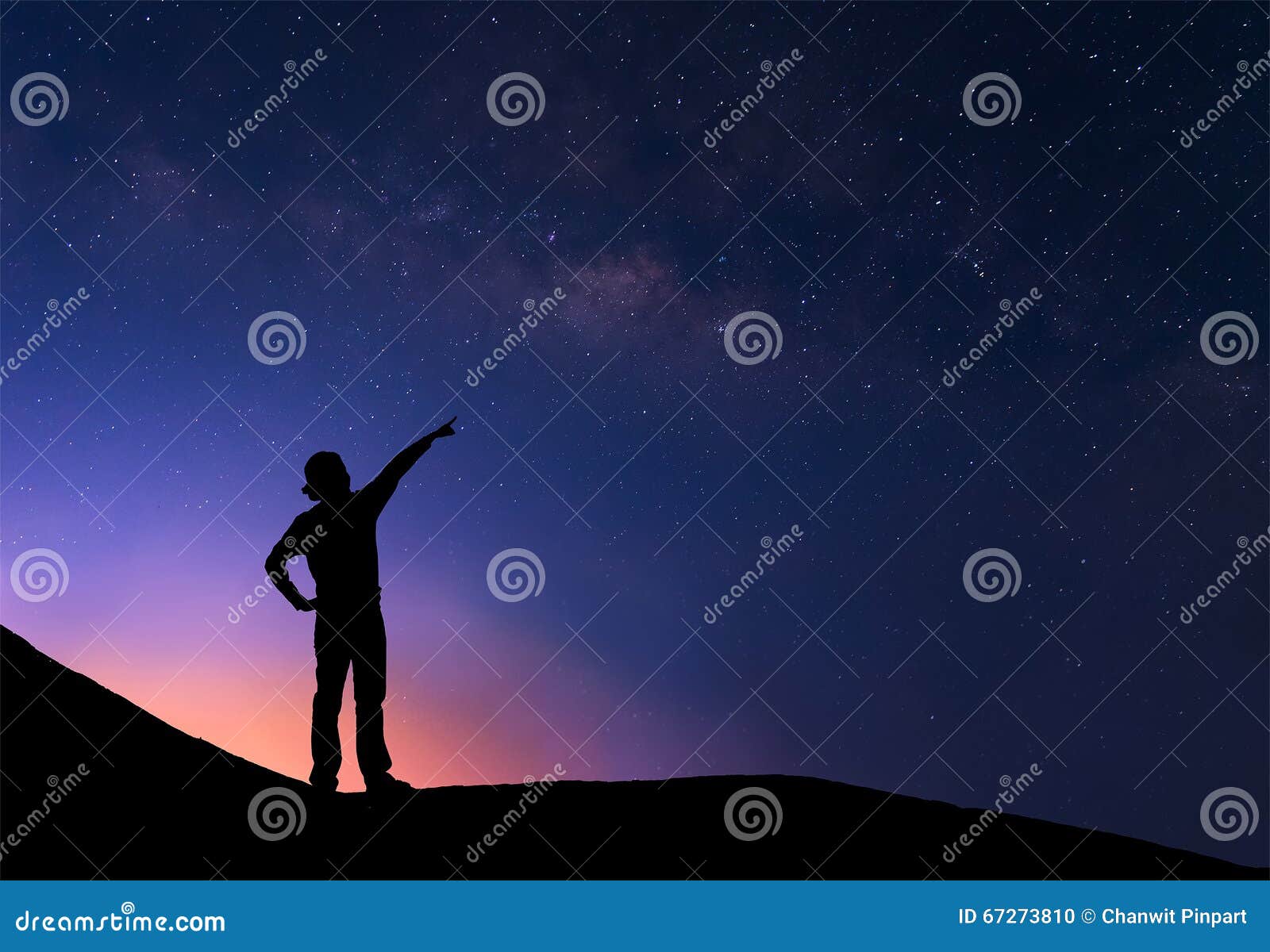 sillhouette of woman standing next to the milky way