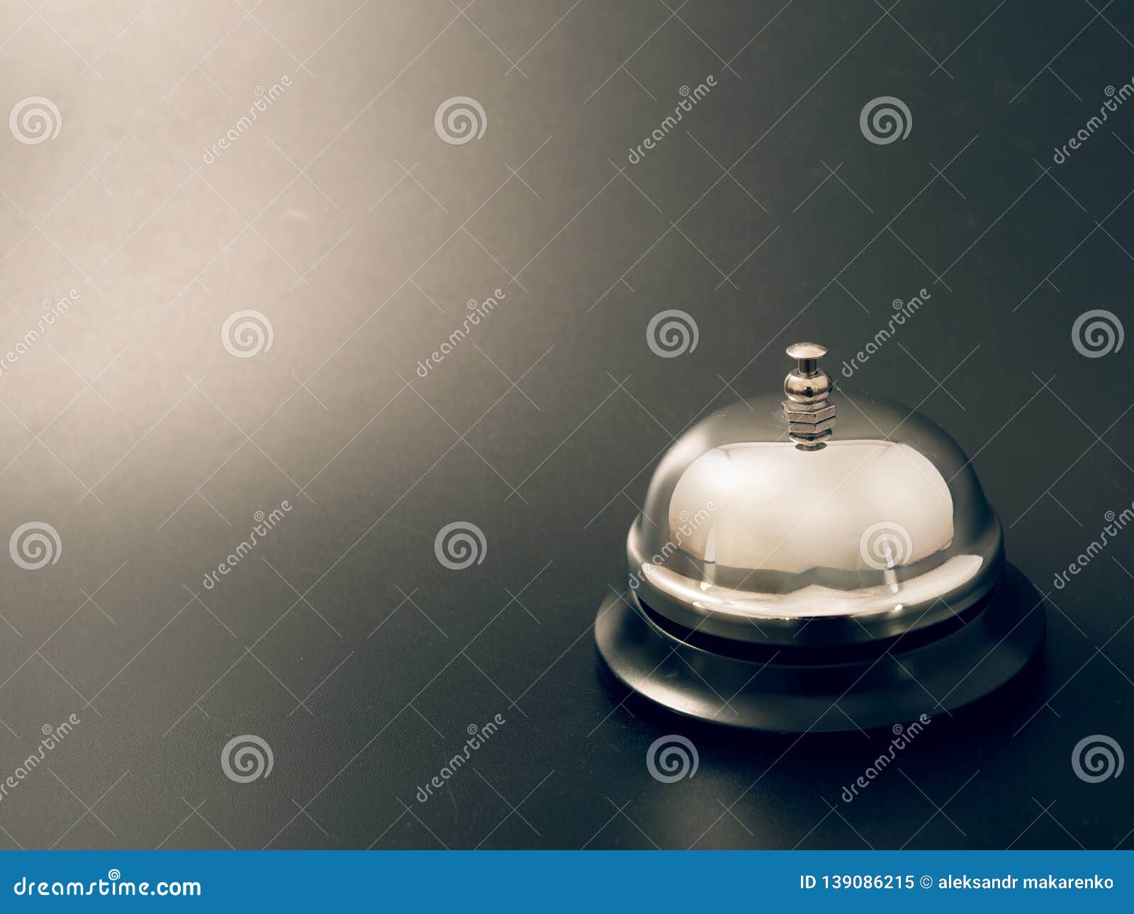 Bell At The Reception Desk Made Of Metal On A Black Background
