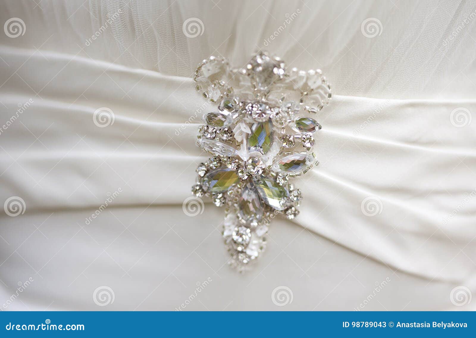 Silver Brooch with Big Rhinestones on White Silk Dress Stock Image ...