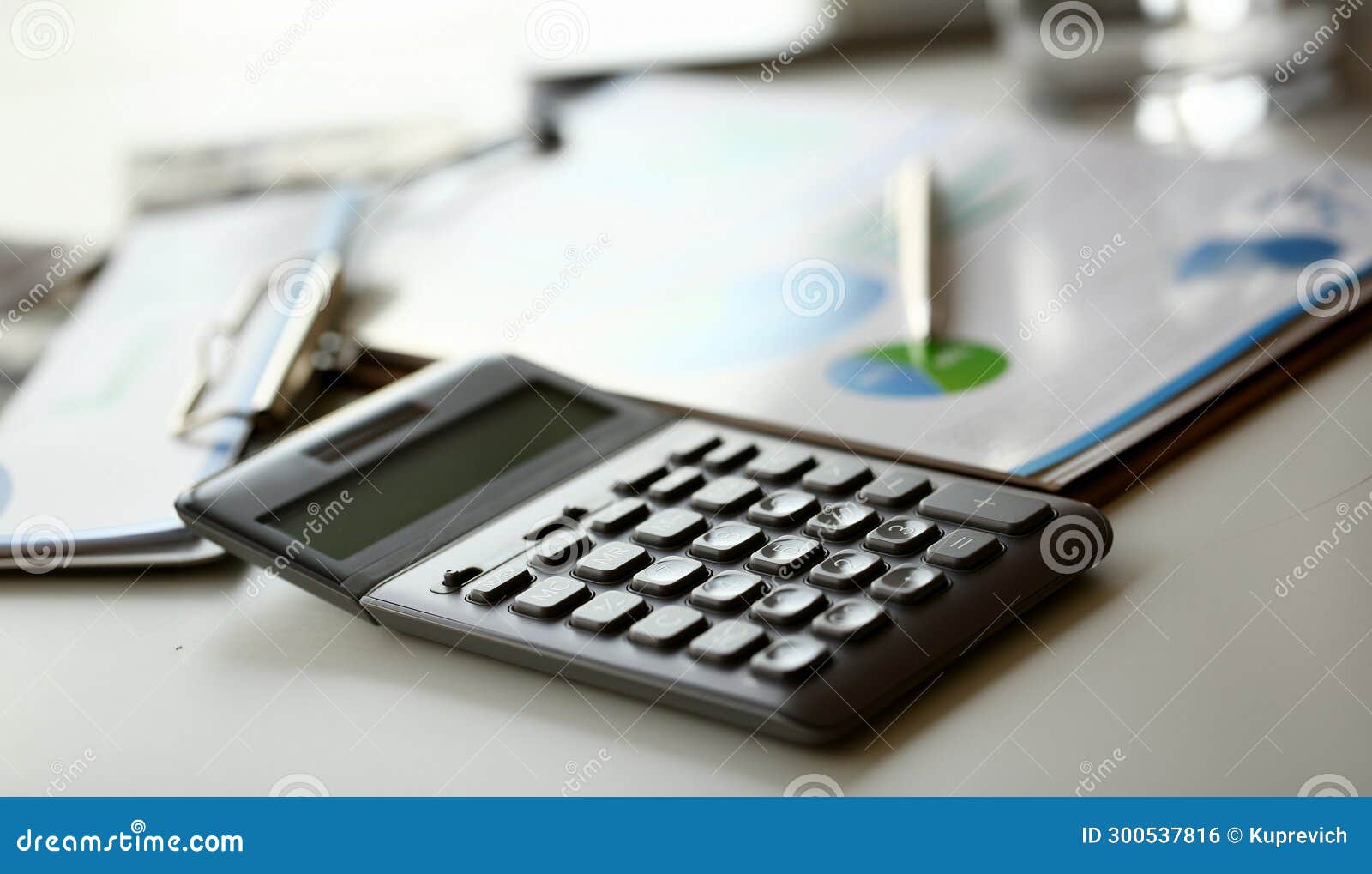 silver calculator with gray keyboard is lying