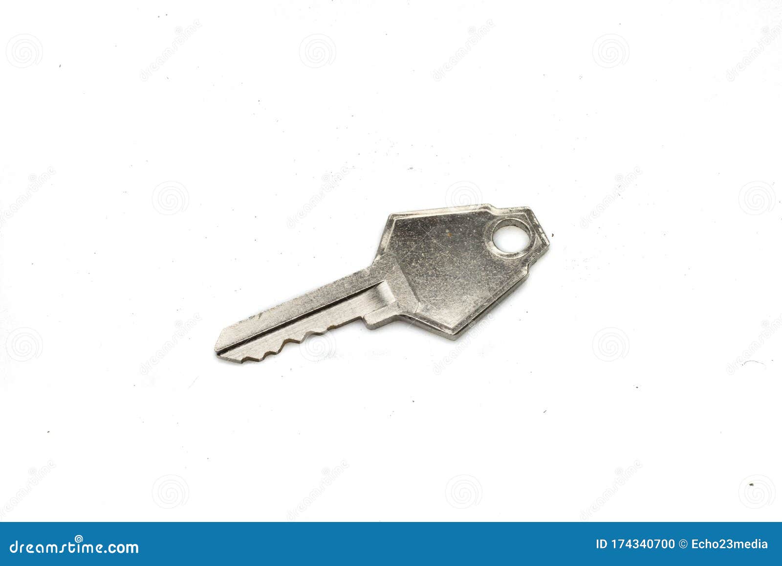 a silver camlock key  on a white background