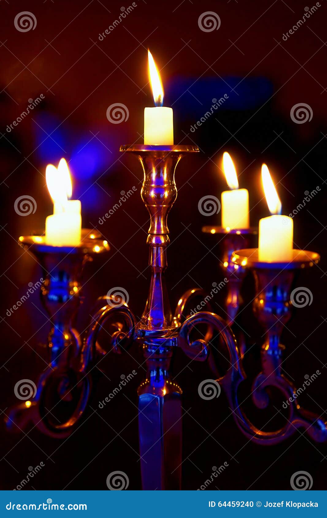 Silver Chandelier and Burning Candles on Decorated Wedding Table. Stock