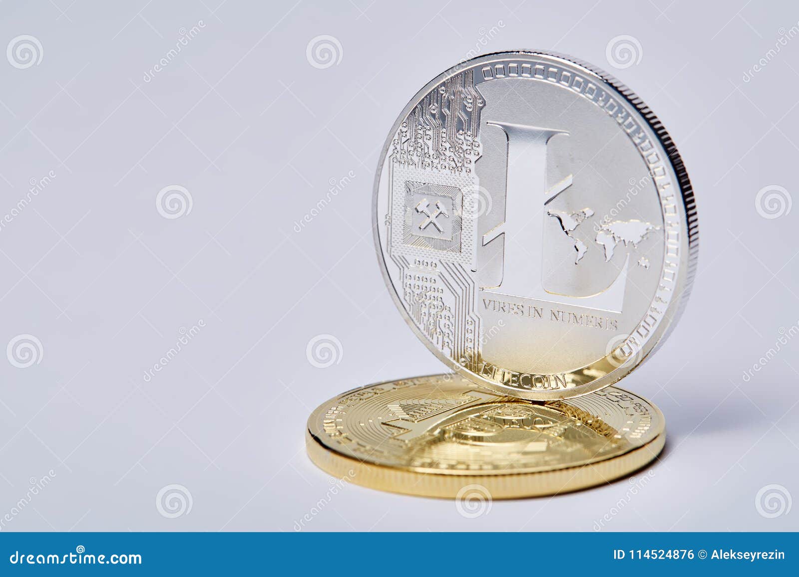 silver coin of digital crypto currency with the  of litecoin on a white background, close-up, macro