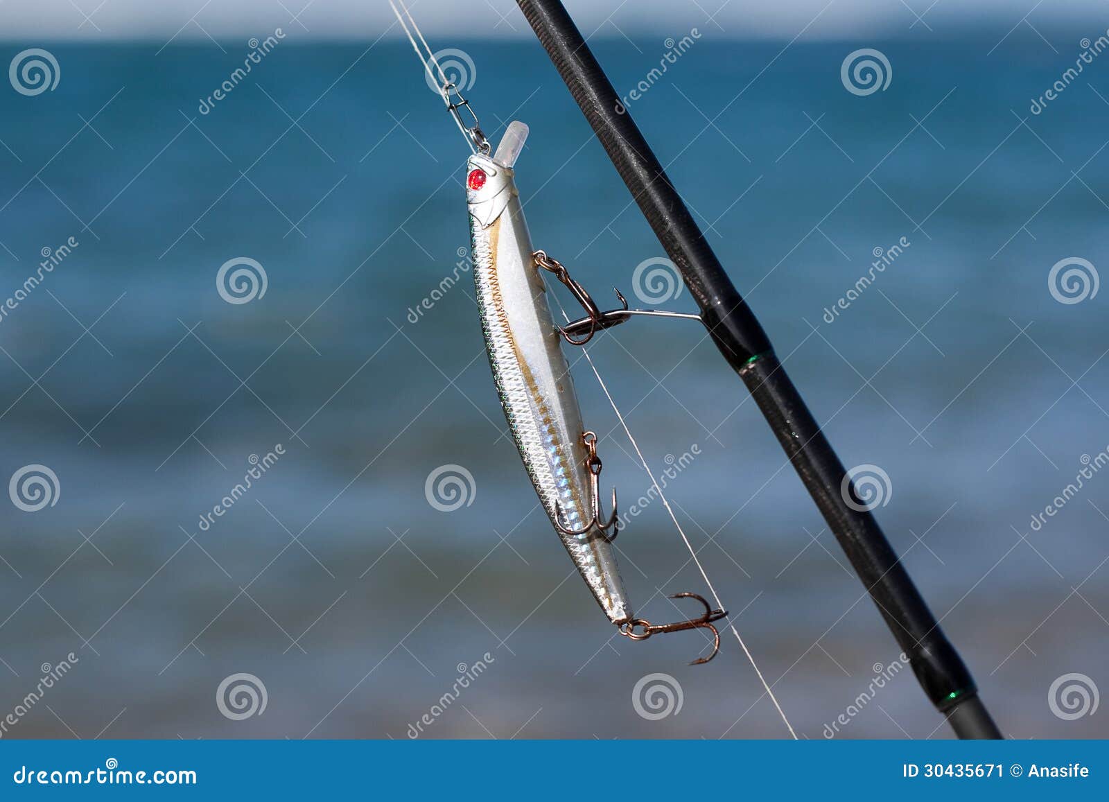 Silver Fishing Lure in Fishing Rod Stock Image - Image of sport, equipment:  30435671