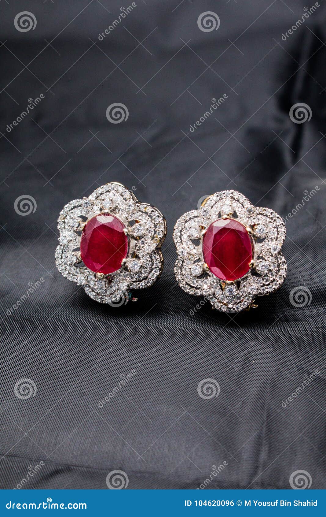 Silver Handmade Flower Shaped Earring with a Red Ruby Stock Photo ...